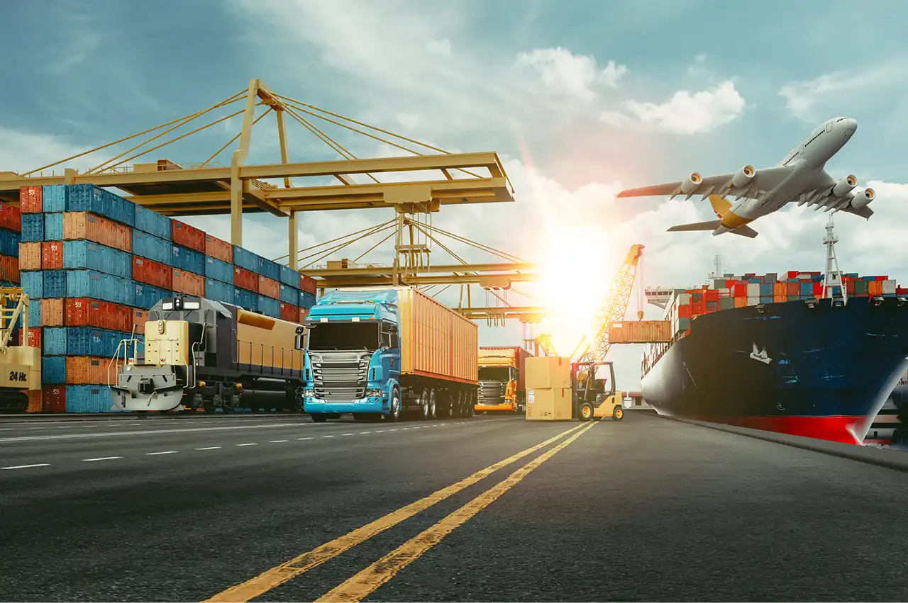 Image of cargo yard with a  plane flying over and a container ship in the background