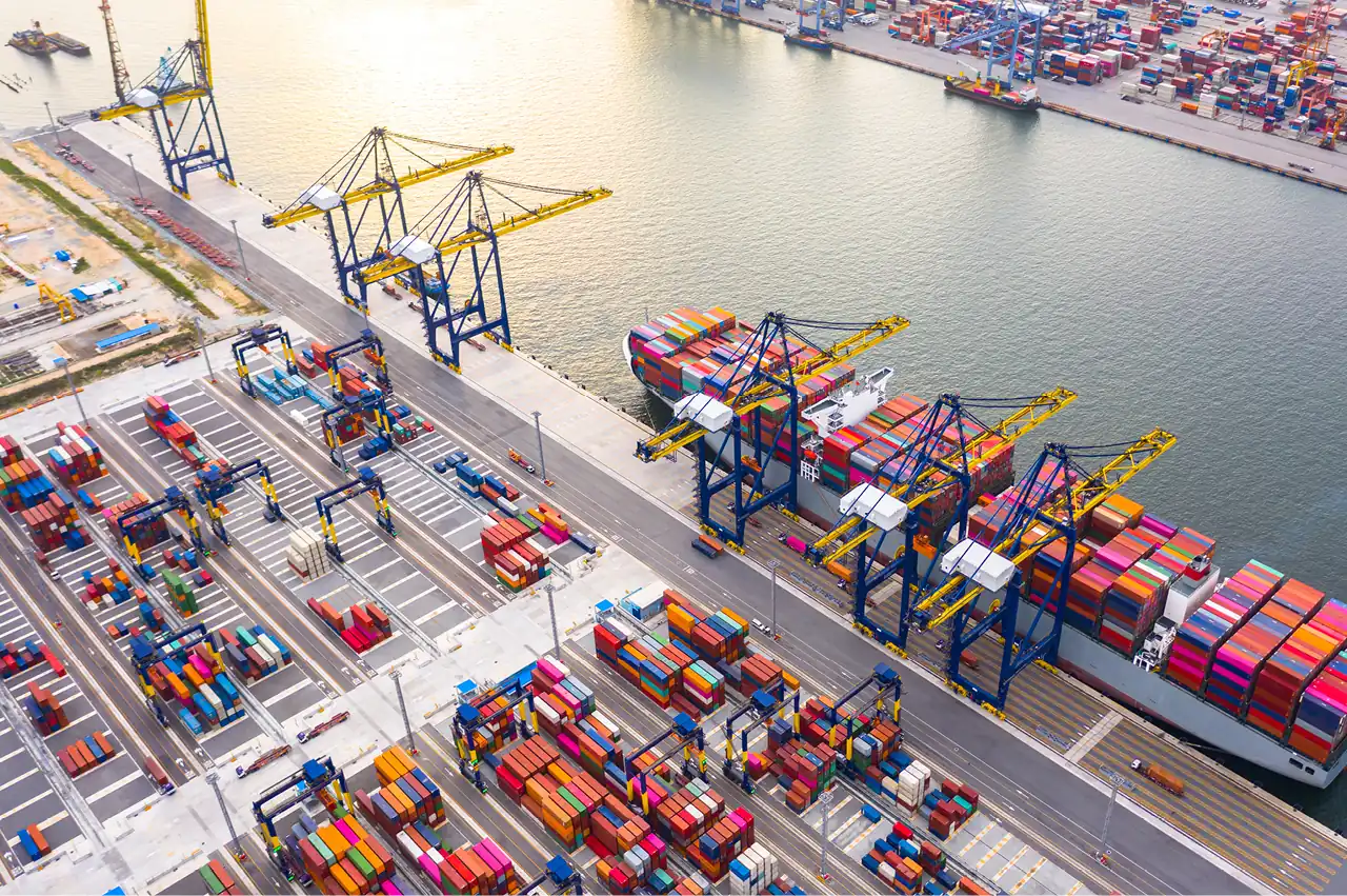 Image of cranes offloading containers from container ships